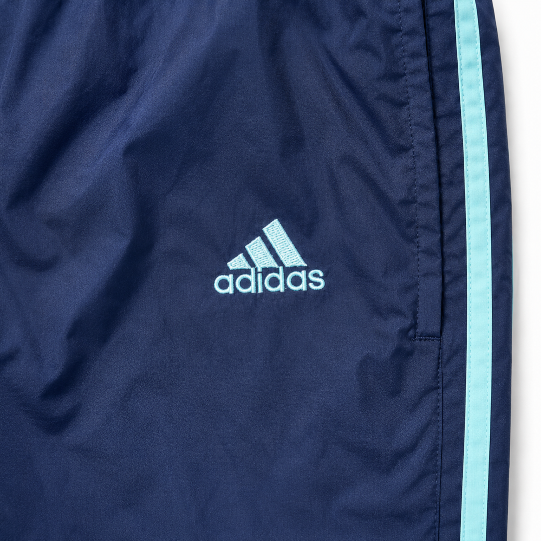 adidas Vintage Track Pants in Navy mit mintfarbenen 3-Streifen – Detailansicht